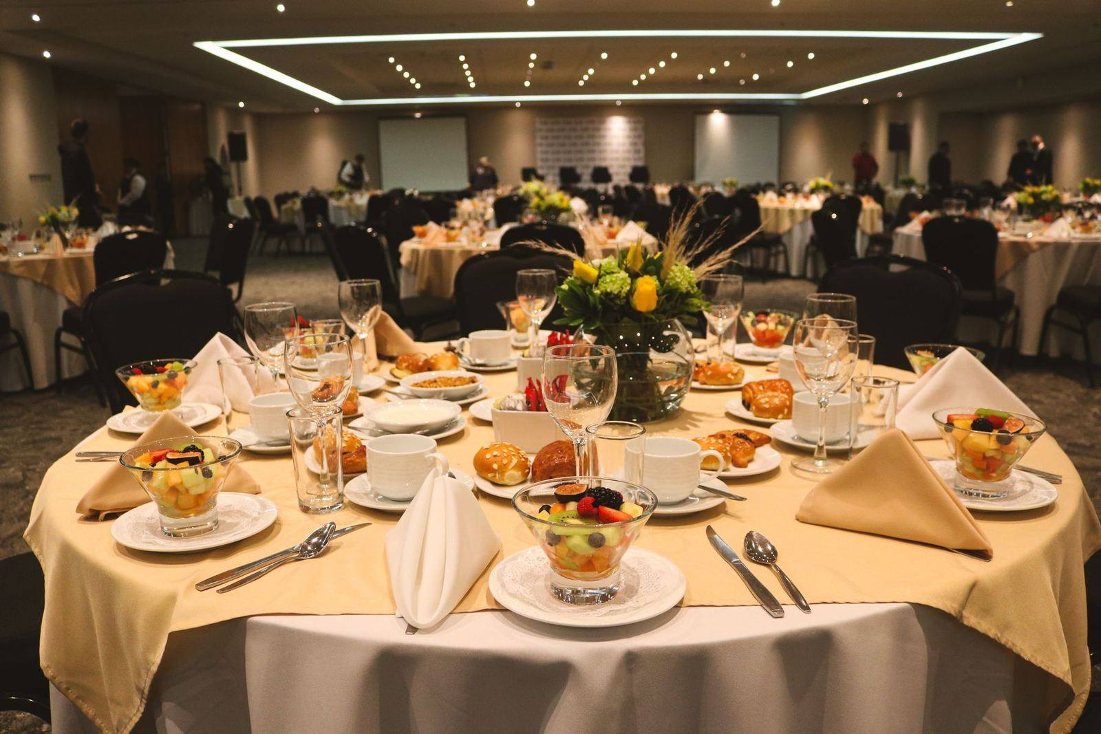 Banquet table with dishes and floral centrepiece