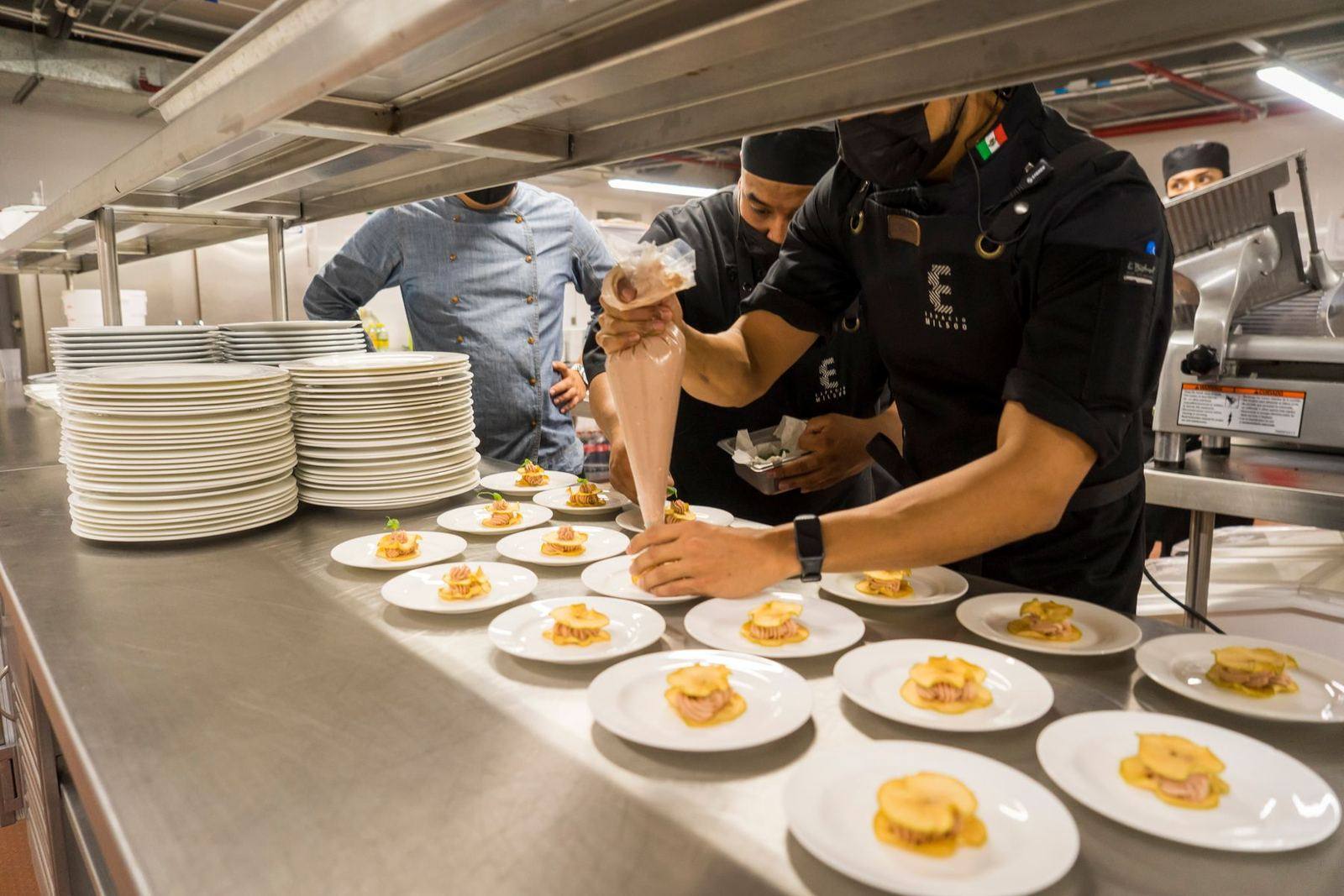 Chefs at the pass at a RASA event