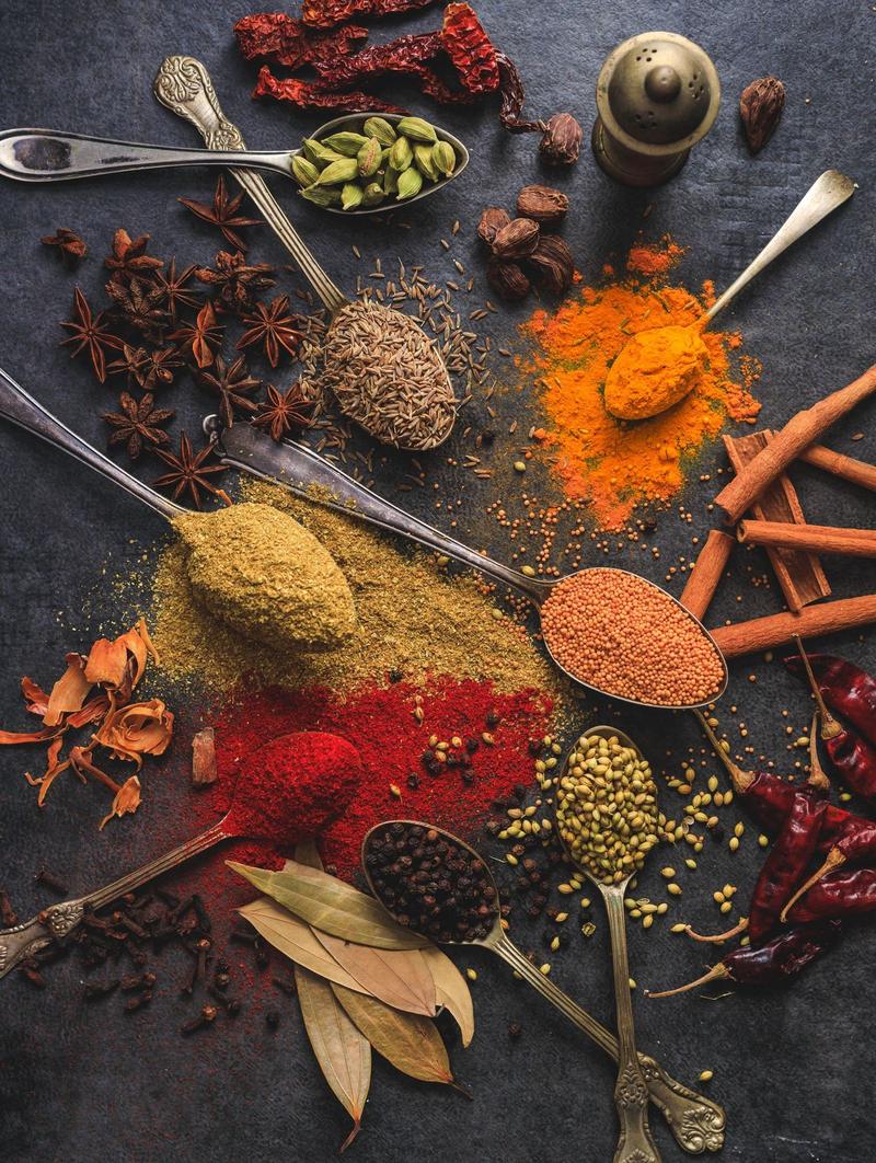 Whole spices on a dark surface